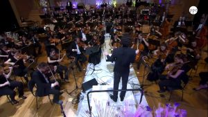 Conducted by Nejc Bečan, the Gimnazija Kranj Symphony Orchestra performs Gershwin: An American in Paris
