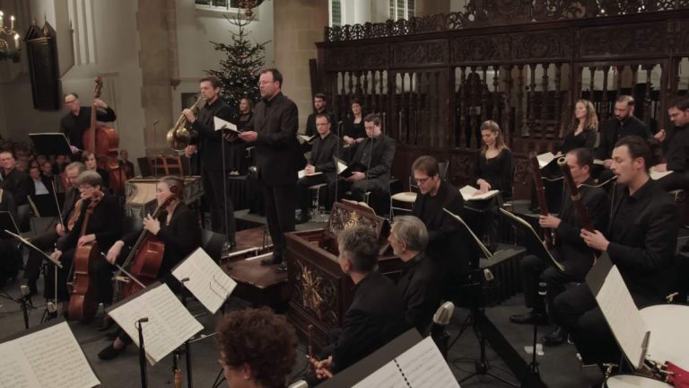 Conducted by Jos van Veldhoven, the Netherlands Bach Society performs Johann Sebastian Bach's "Mass in B minor, BWV 232", a musical setting of the complete Ordinary of the Latin Mass. This performance was recorded for the Netherlands Bach Society's project All of Bach on December 15, 2016, at the Grote Kerk, Naarden.